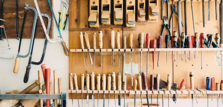 assorted handheld tools in tool rack